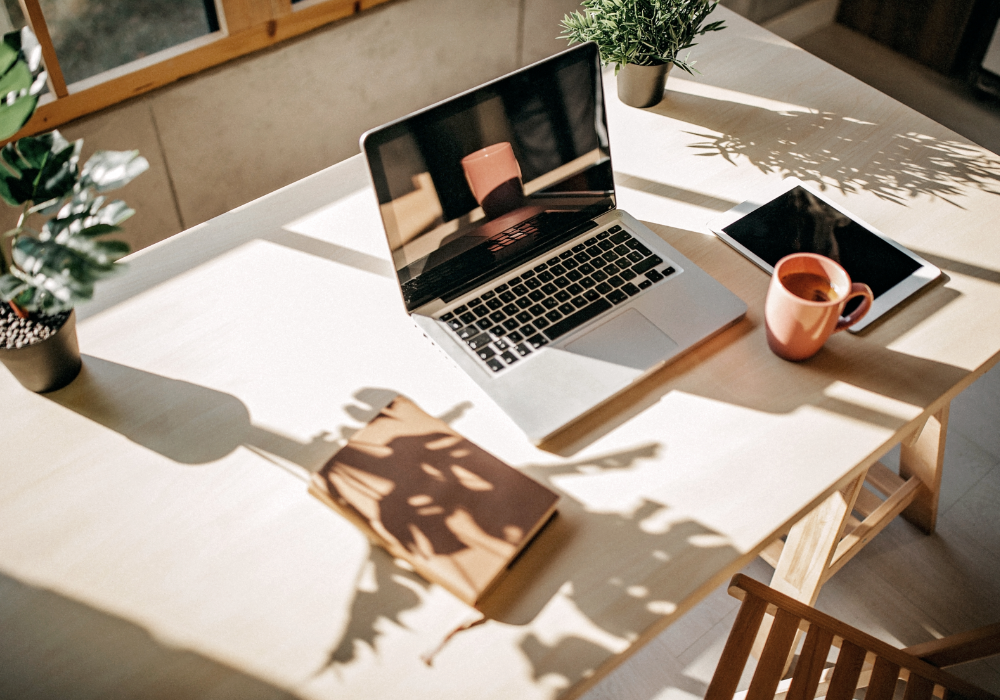 Laptop on the desk with cup of coffee